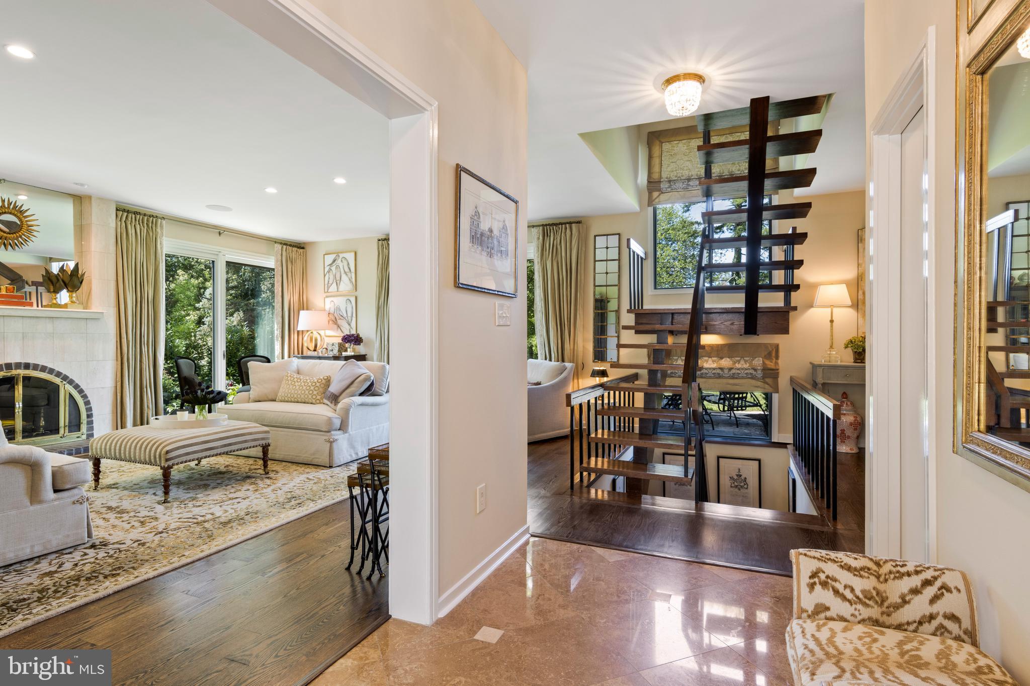 4 Brettagne, Unit 4 Devon, PA 19333 - Photo 4 of 26 a living room with furniture a dining table and a large window