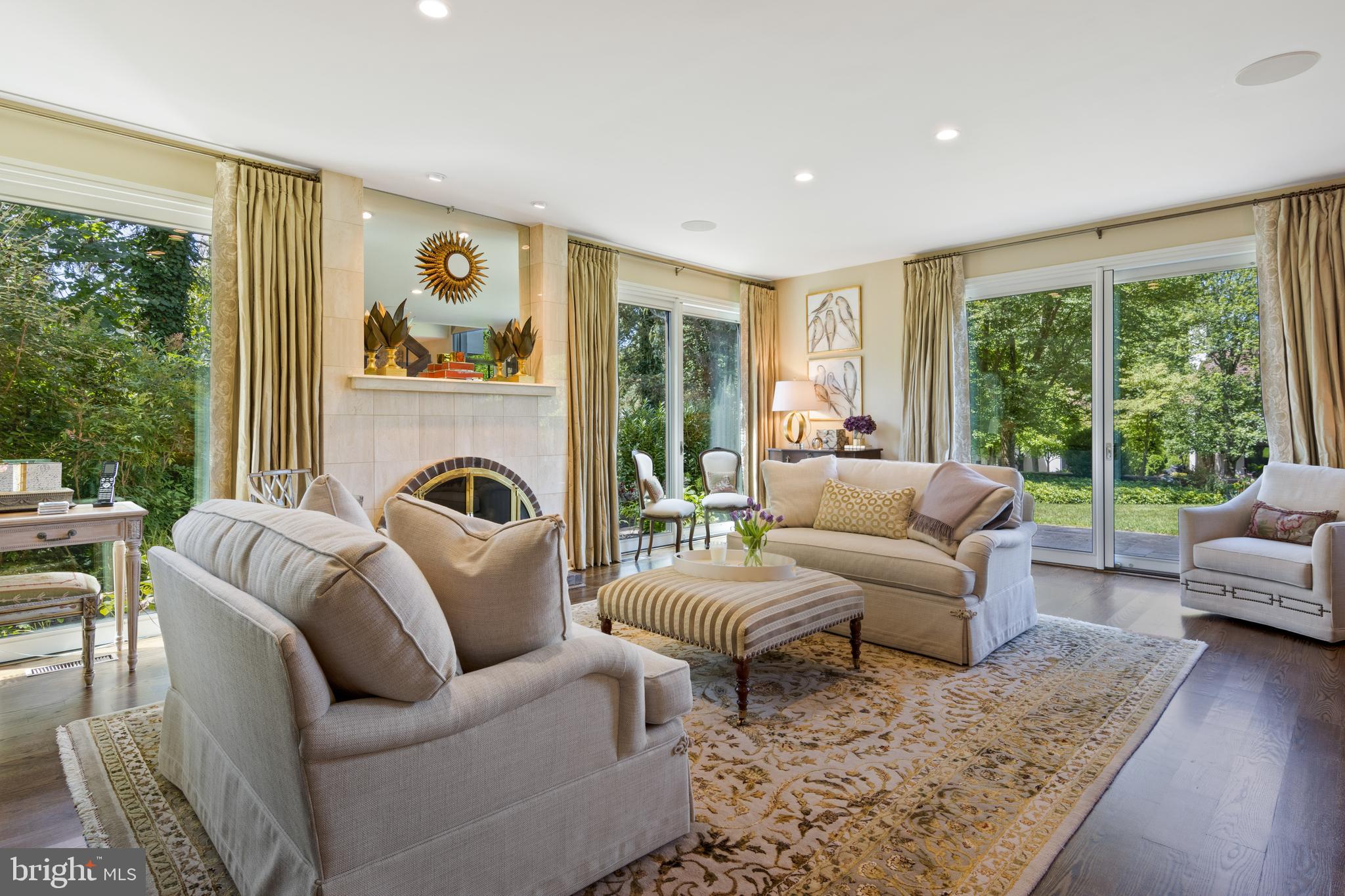 4 Brettagne, Unit 4 Devon, PA 19333 - Photo 5 of 26 a living room with furniture fireplace and a large window