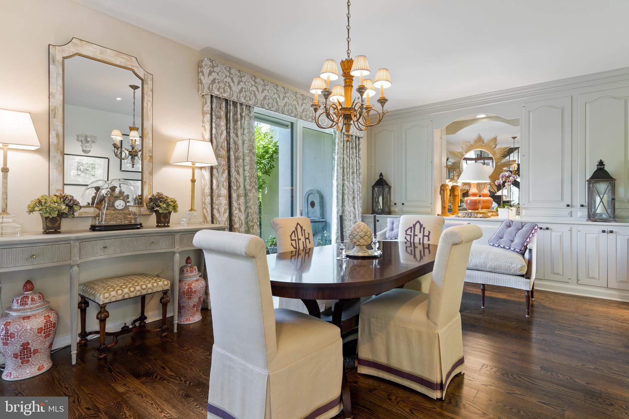 4 Brettagne, Unit 4 Devon, PA 19333 - Photo 9 of 26 a view of a dining room with furniture wooden floor and chandelier