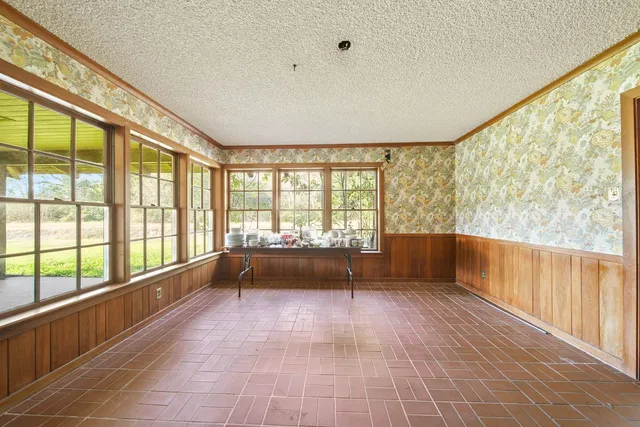 a kitchen with stainless steel appliances a refrigerator sink and cabinets