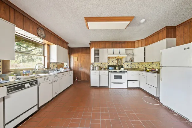 a view of a hallway with windows