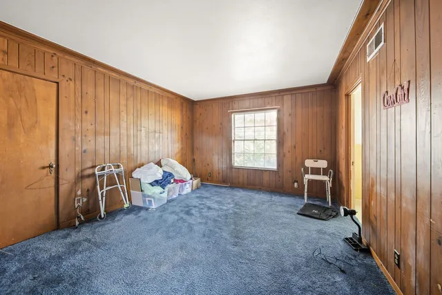 a living room with lots of furniture and a wooden floor