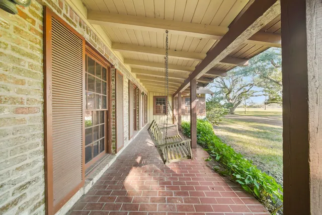 a view of a livingroom with furniture and an entrance