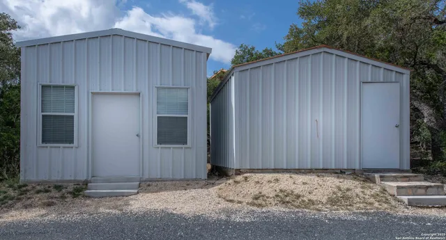 a view of storage and utility room with a refrigerator