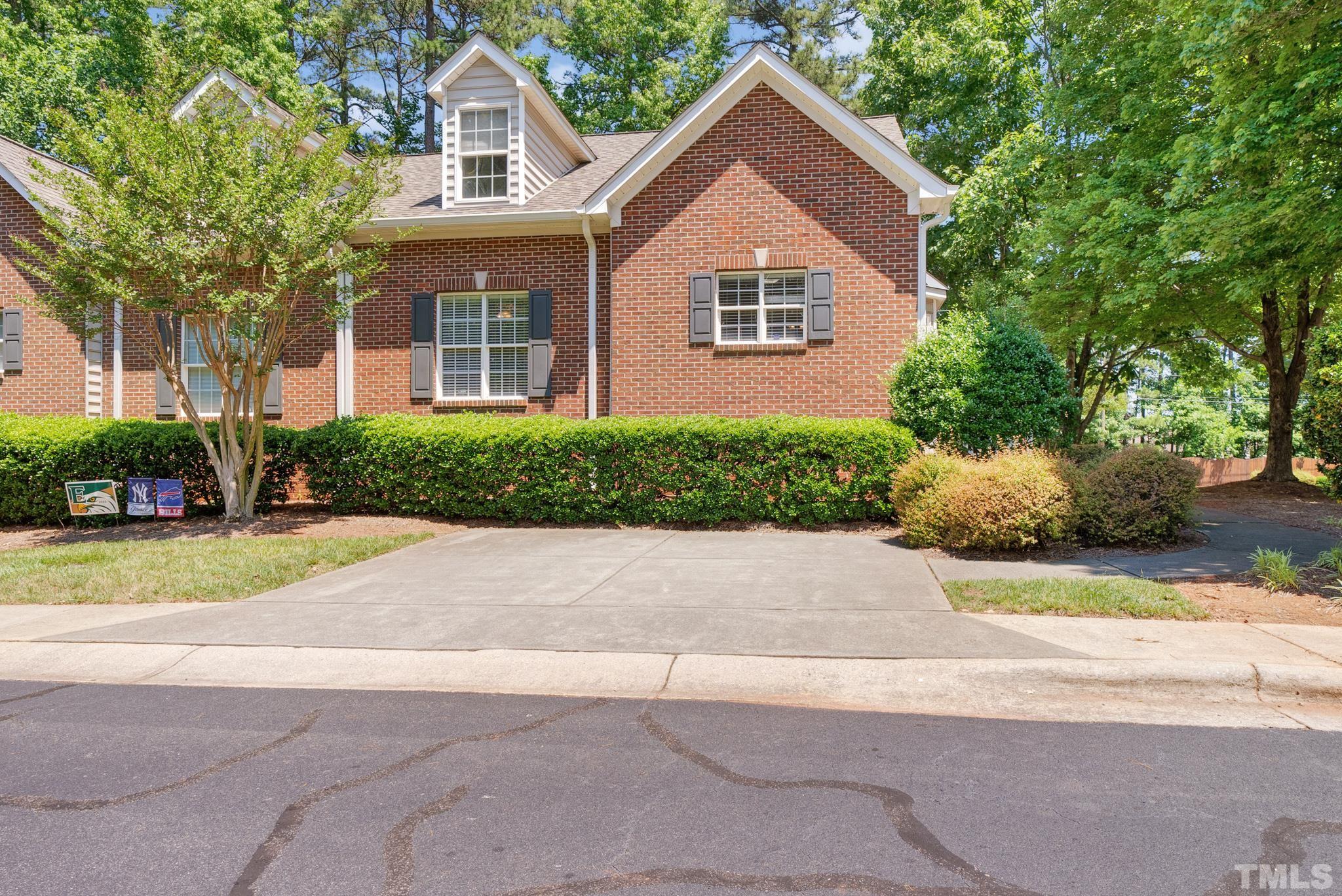 9553 Hanging Rock Road Raleigh, NC 27613 - Photo 1 of 36 a front view of a house with a yard and garage