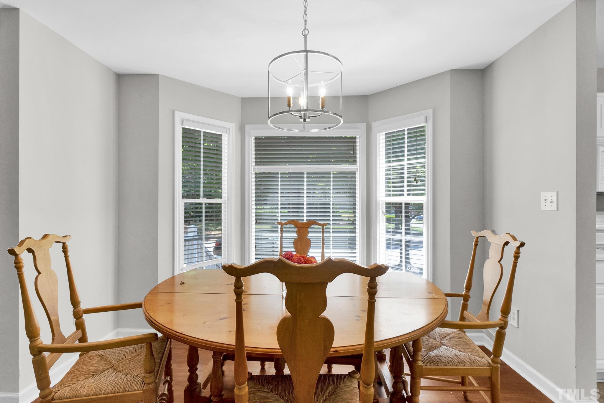 9553 Hanging Rock Road Raleigh, NC 27613 - Photo 12 of 36 a view of a dining room with furniture window and outside view