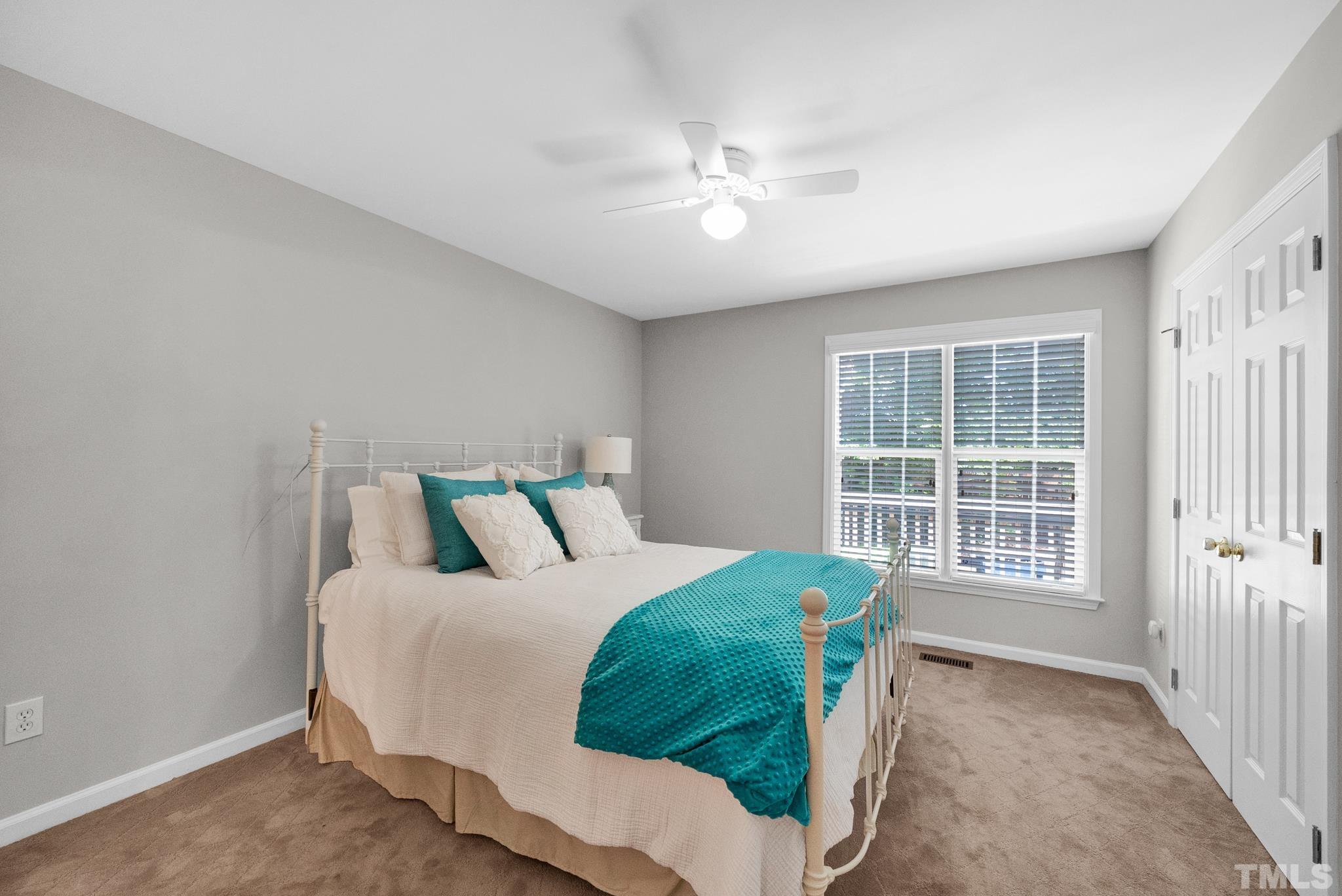 9553 Hanging Rock Road Raleigh, NC 27613 - Photo 13 of 36 a bedroom with a bed and a window