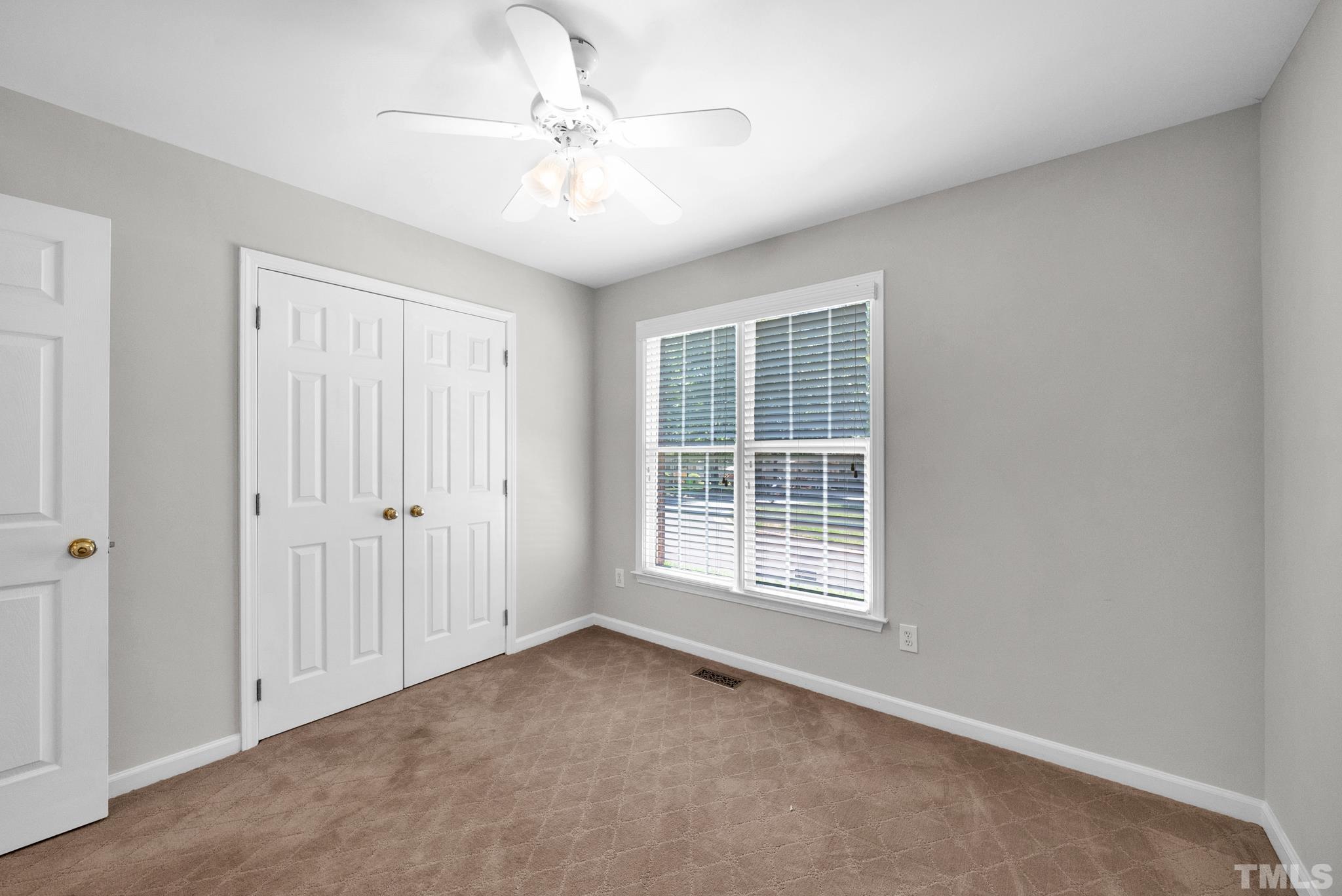 9553 Hanging Rock Road Raleigh, NC 27613 - Photo 17 of 36 a view of an empty room with a window