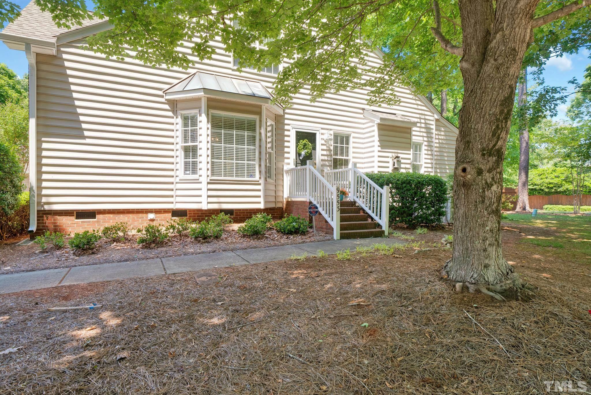 9553 Hanging Rock Road Raleigh, NC 27613 - Photo 31 of 36 a front view of a house with garden