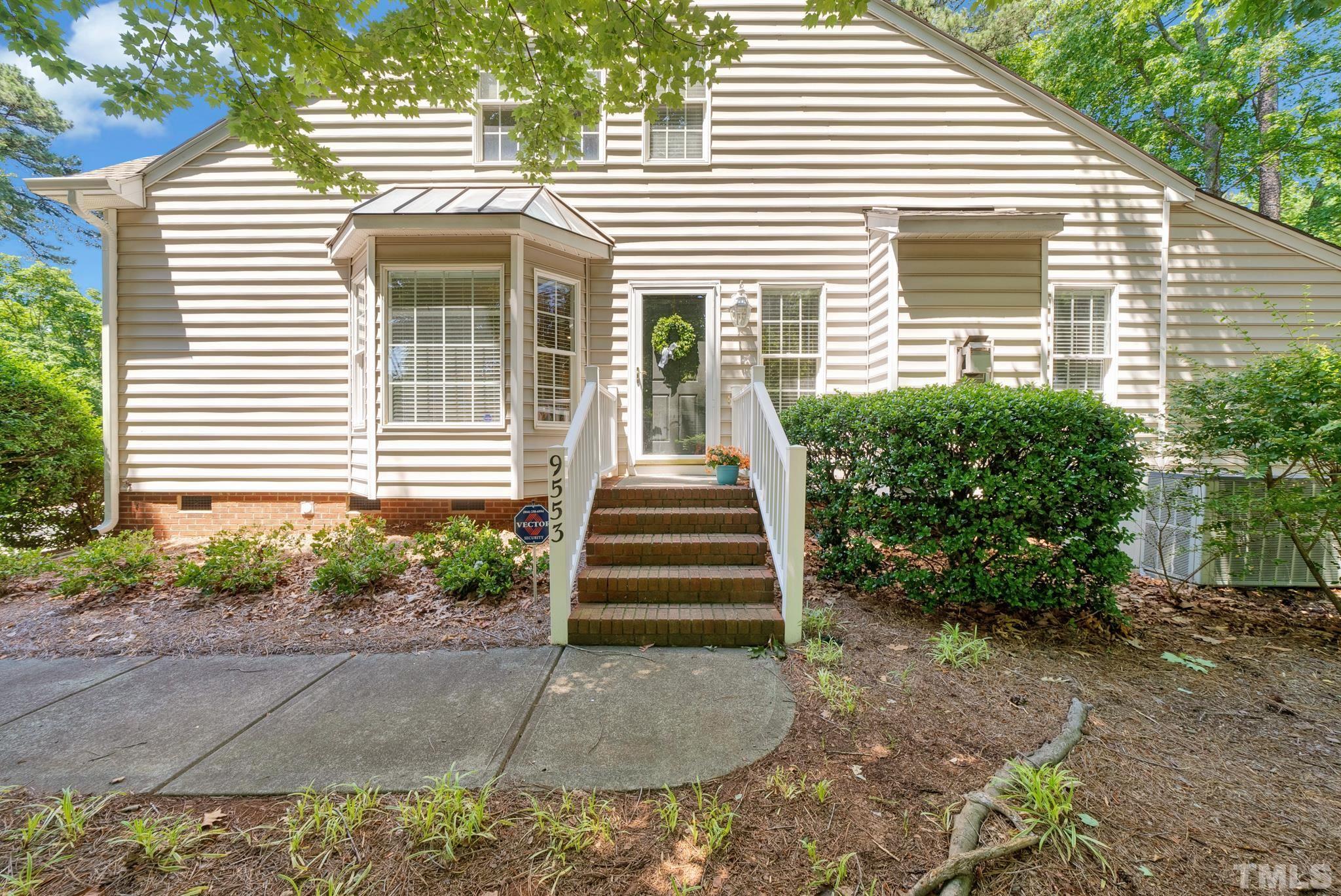 9553 Hanging Rock Road Raleigh, NC 27613 - Photo 32 of 36 a front view of a house with a yard