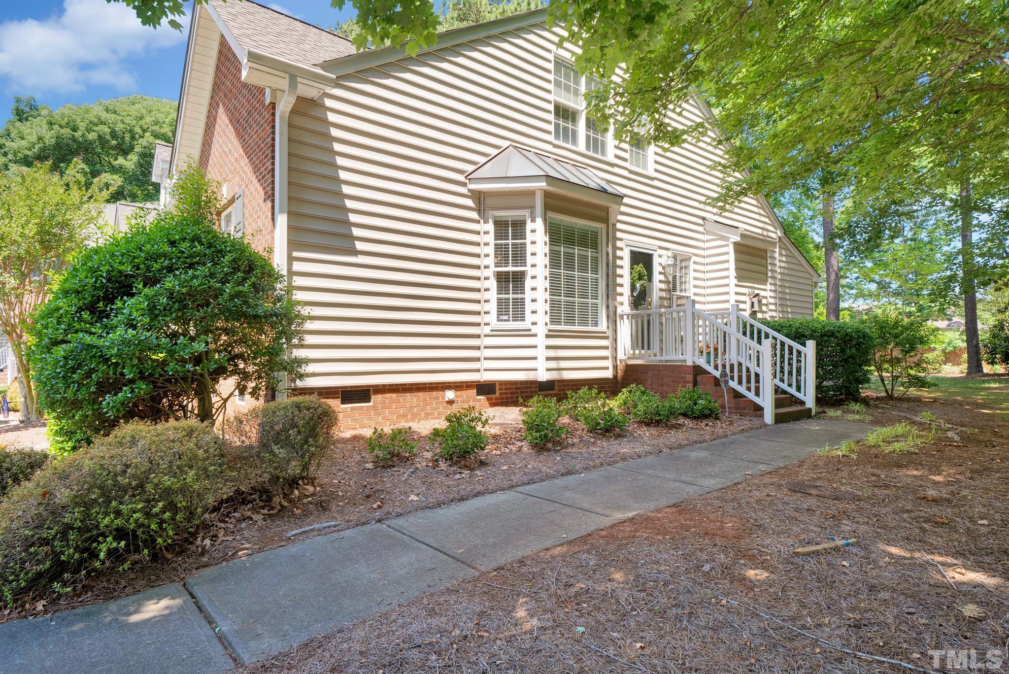 9553 Hanging Rock Road Raleigh, NC 27613 - Photo 35 of 36 a front view of a house with garden