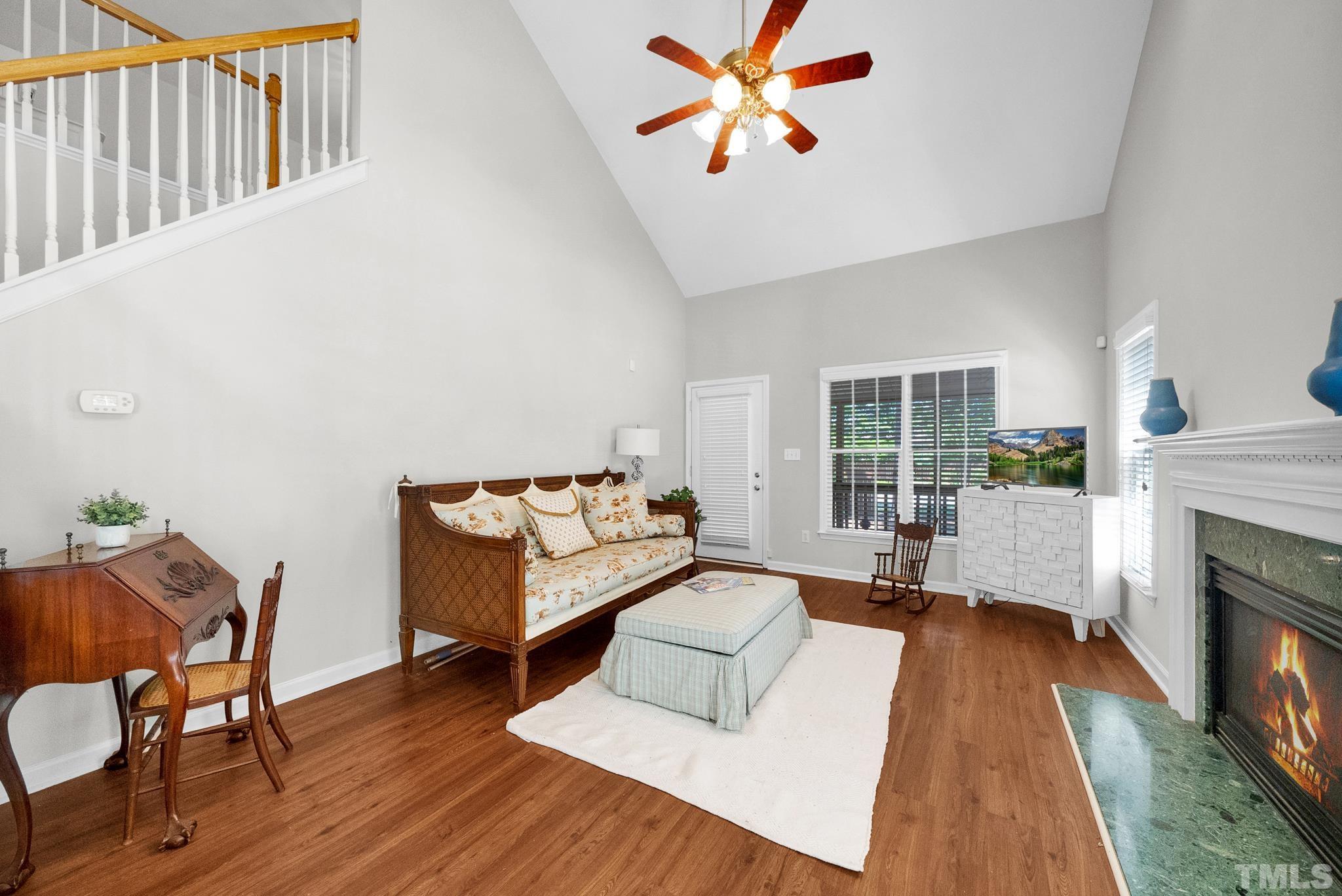 9553 Hanging Rock Road Raleigh, NC 27613 - Photo 5 of 36 a living room with furniture and a fireplace