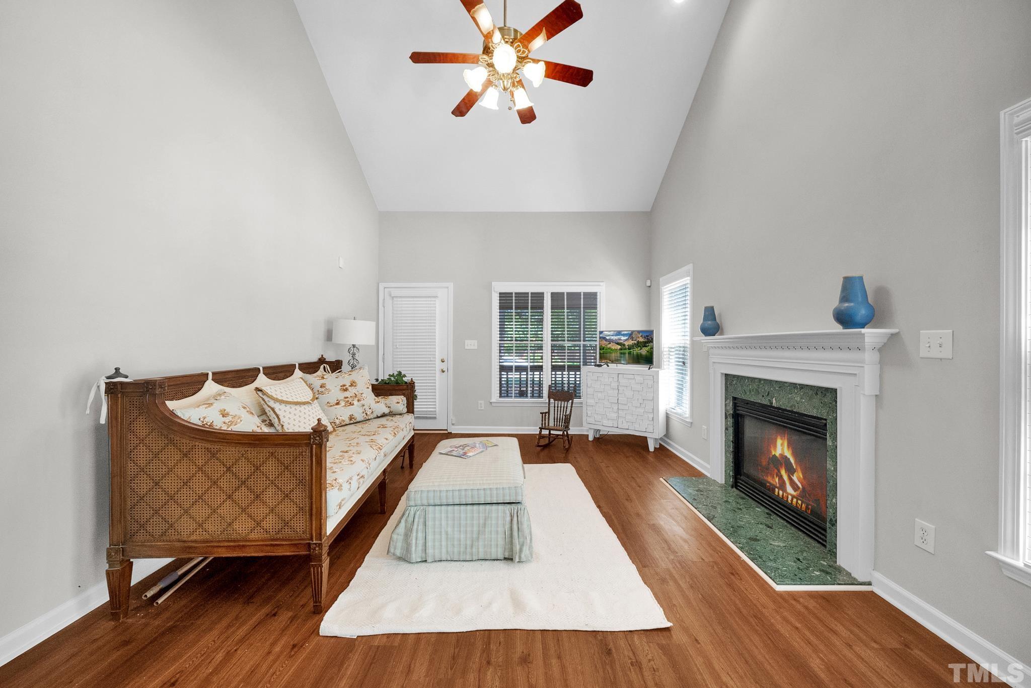 9553 Hanging Rock Road Raleigh, NC 27613 - Photo 6 of 36 a living room with furniture and a fireplace