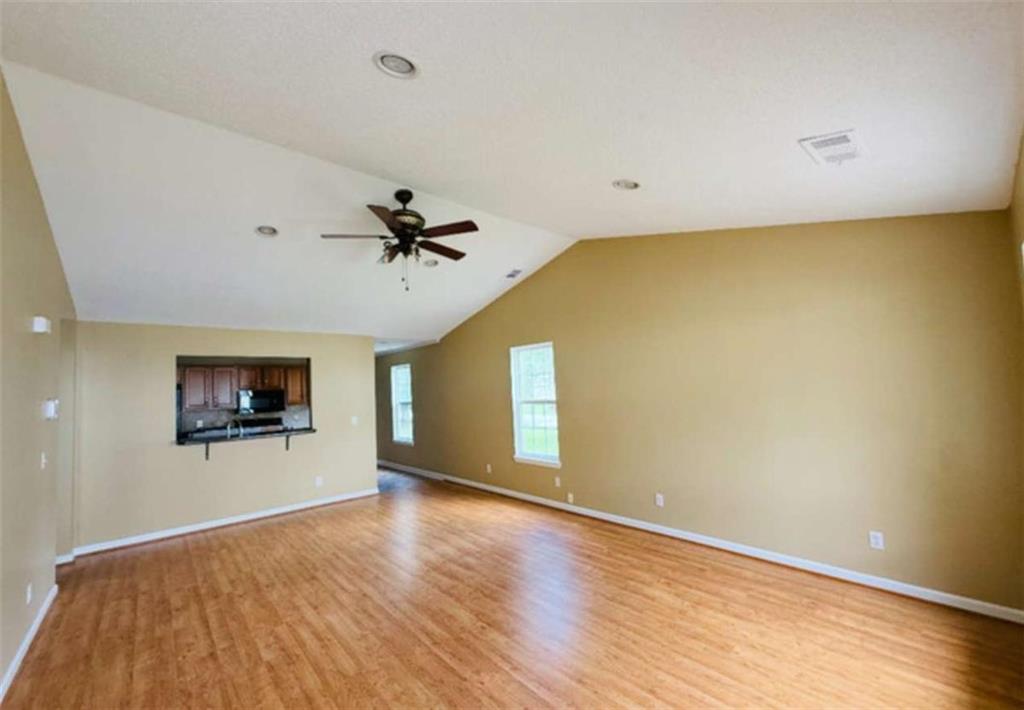 153 Crest Pointe Bremen, GA 30110 - Photo 5 of 24 wooden floor in an empty room with a window