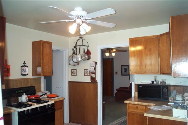 4203 Cline Road Amarillo, TX 79110 - Photo 6 of 11 a kitchen with stainless steel appliances granite countertop a refrigerator a stove and a sink