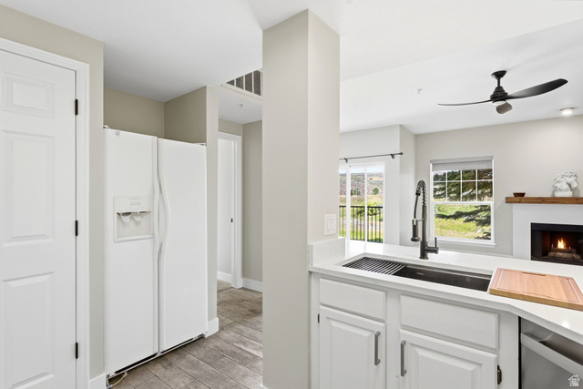 900 Bitner Road, Unit P17 Park City, UT 84098 - Photo 2 of 45 Kitchen island with a black undermount sink, gooseneck faucet, and quartz countertop