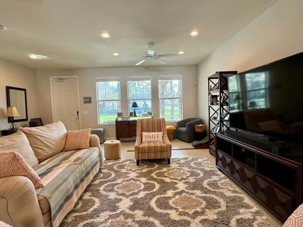 a living room with furniture and a flat screen tv