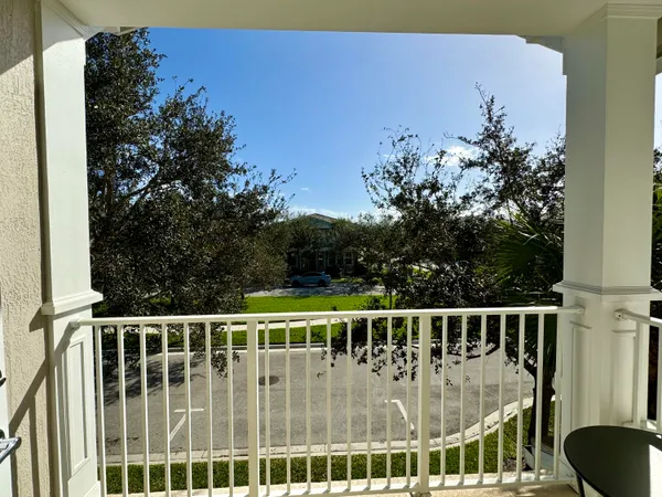 a view of a chair and table in the balcony