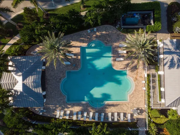 a view of a backyard with sitting area