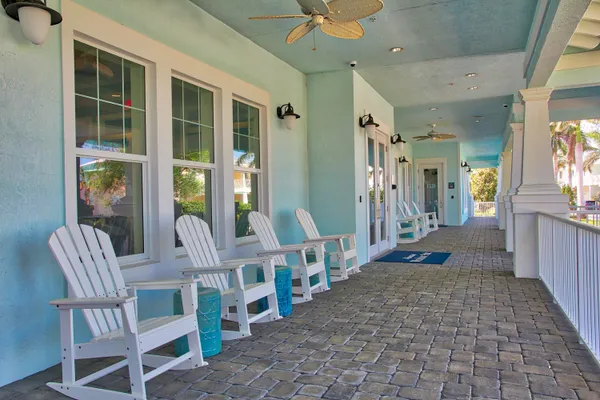 a swimming pool with outdoor seating and yard