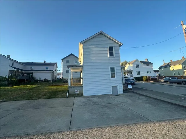 a view of a house and a yard