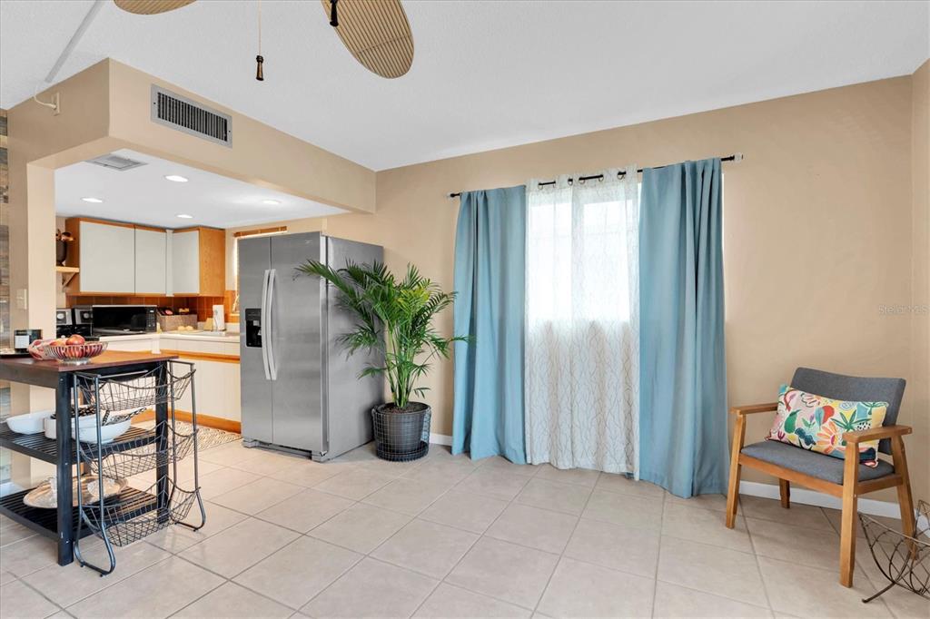 8800 Blind Pass Road, Unit 10 St. Pete Beach, FL 33706 - Photo 7 of 24 a view of kitchen with furniture and a potted plant
