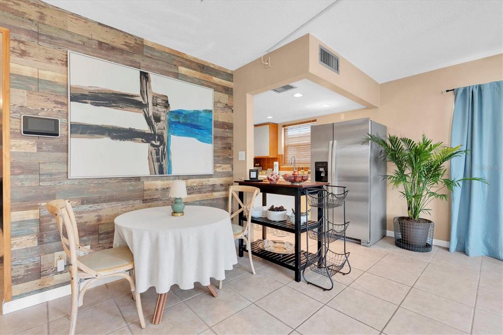 8800 Blind Pass Road, Unit 10 St. Pete Beach, FL 33706 - Photo 8 of 24 a reading room with furniture and a potted plant