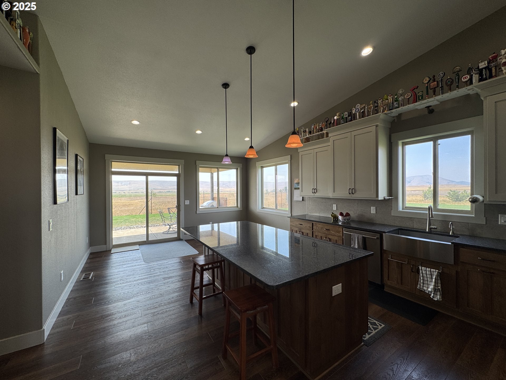 1818 Centerville Highway Centerville, WA 98613 - Photo 16 of 42 a kitchen with granite countertop a sink appliances and wooden floor
