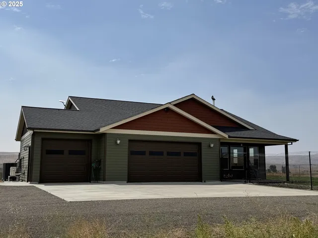 a front view of a house with yard
