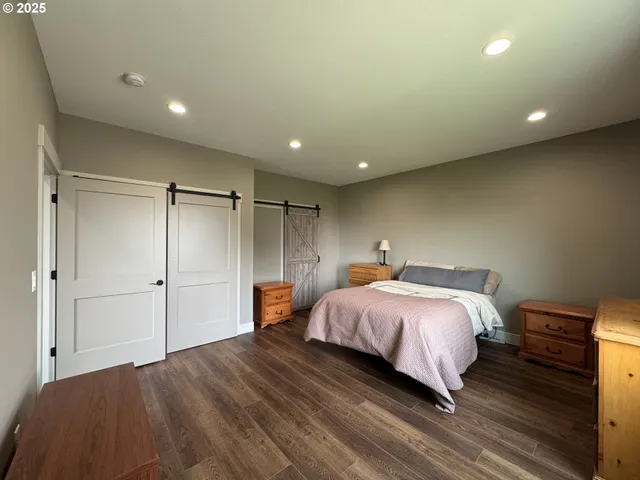 a bedroom with a bed and a closet