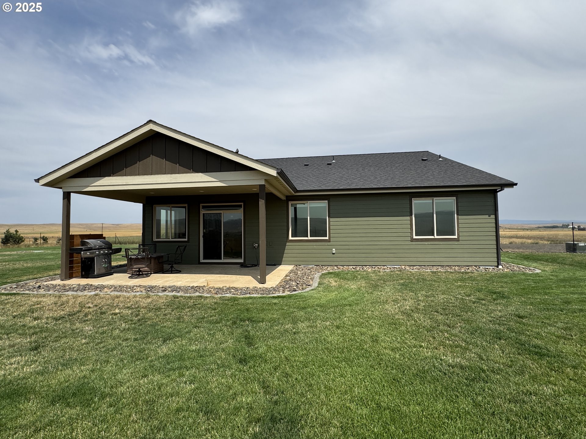 1818 Centerville Highway Centerville, WA 98613 - Photo 5 of 42 a front view of a house with a yard table and chairs