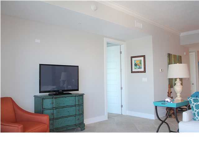 211 Durango Road, Unit 416 Destin, FL 32541 - Photo 13 of 34 a living room with furniture a flat screen tv and a window