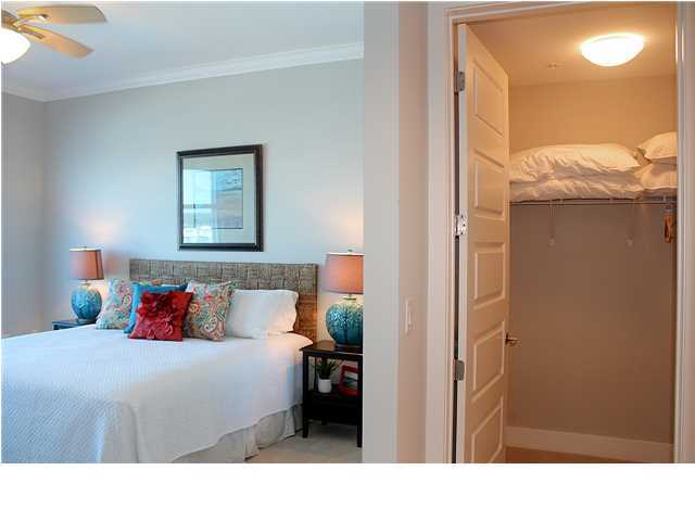 211 Durango Road, Unit 416 Destin, FL 32541 - Photo 14 of 34 a bedroom with a bed and a mirror