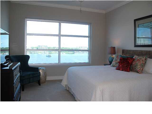 211 Durango Road, Unit 416 Destin, FL 32541 - Photo 15 of 34 a living room with a bed furniture and a window