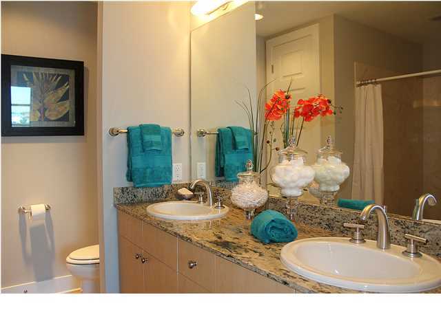 211 Durango Road, Unit 416 Destin, FL 32541 - Photo 17 of 34 a bathroom with a sink vanity mirror and toilet