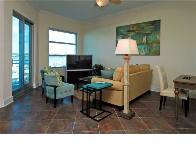 211 Durango Road, Unit 416 Destin, FL 32541 - Photo 26 of 34 a living room with furniture a window and a flat screen tv