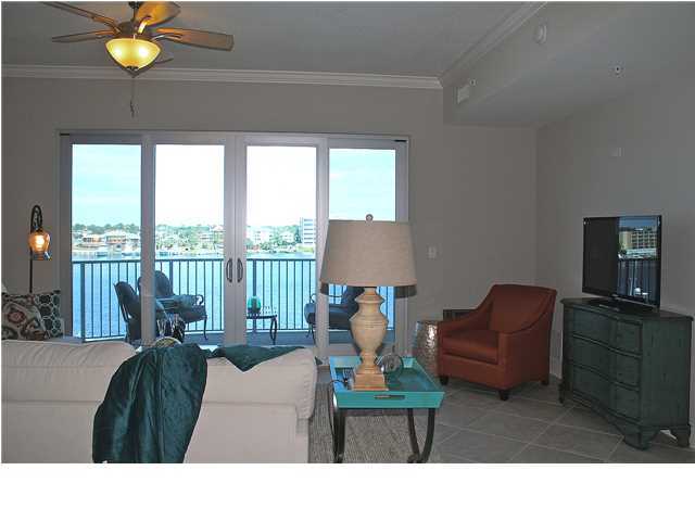 211 Durango Road, Unit 416 Destin, FL 32541 - Photo 3 of 34 a living room with furniture and floor to ceiling windows
