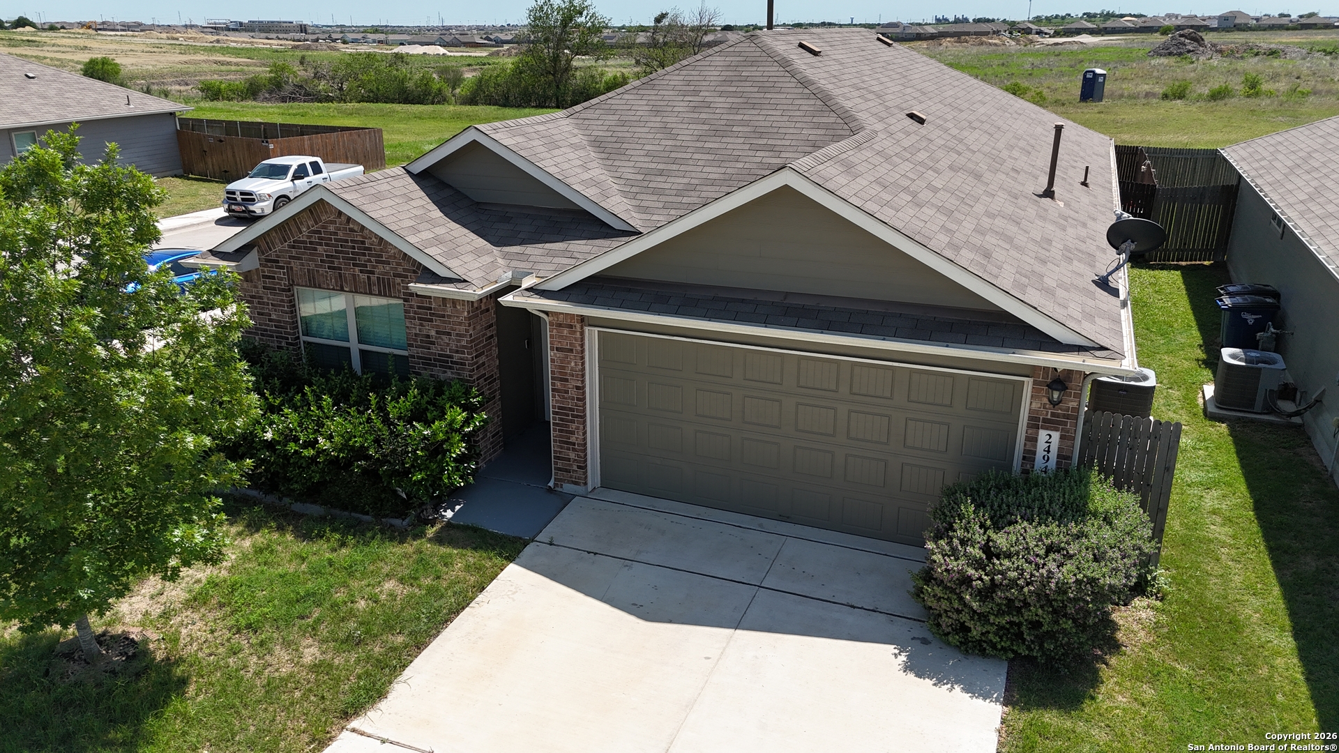 a house with lots of trees in the background