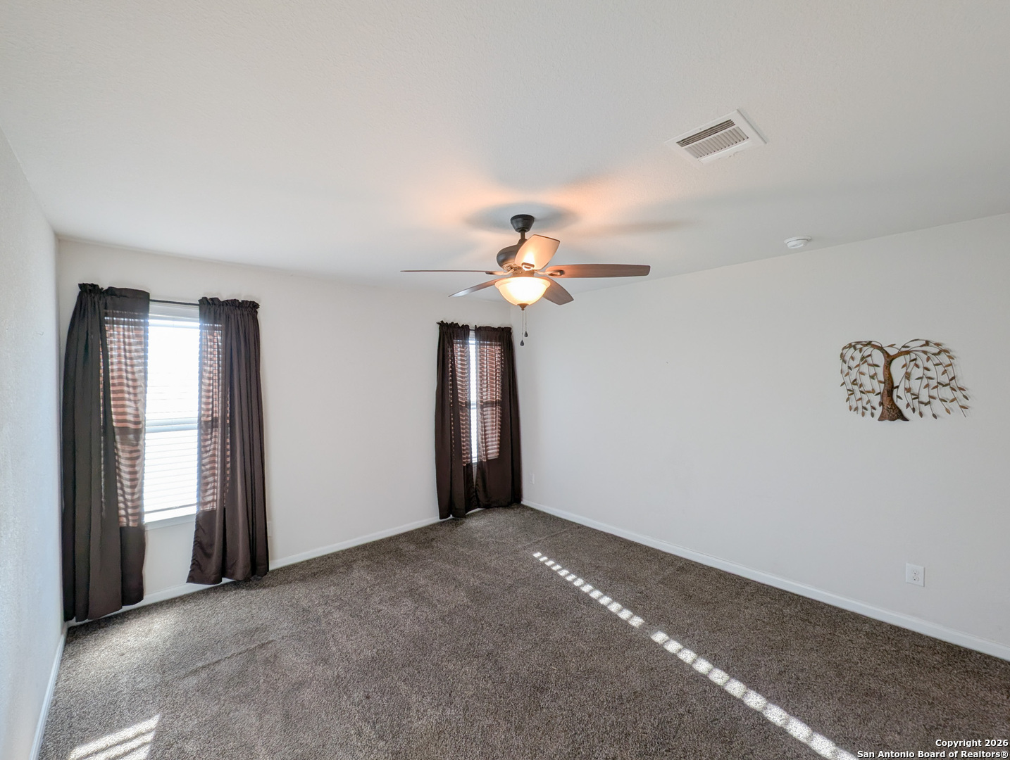 2494 McCrae New Braunfels, TX 78130 - Photo 11 of 22 a view of a room with a ceiling fan and a window