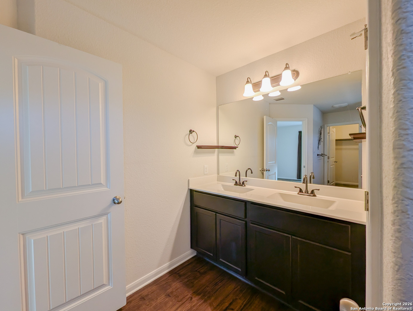 2494 McCrae New Braunfels, TX 78130 - Photo 12 of 22 a en suite bathroom with a double vanity sink and a mirror