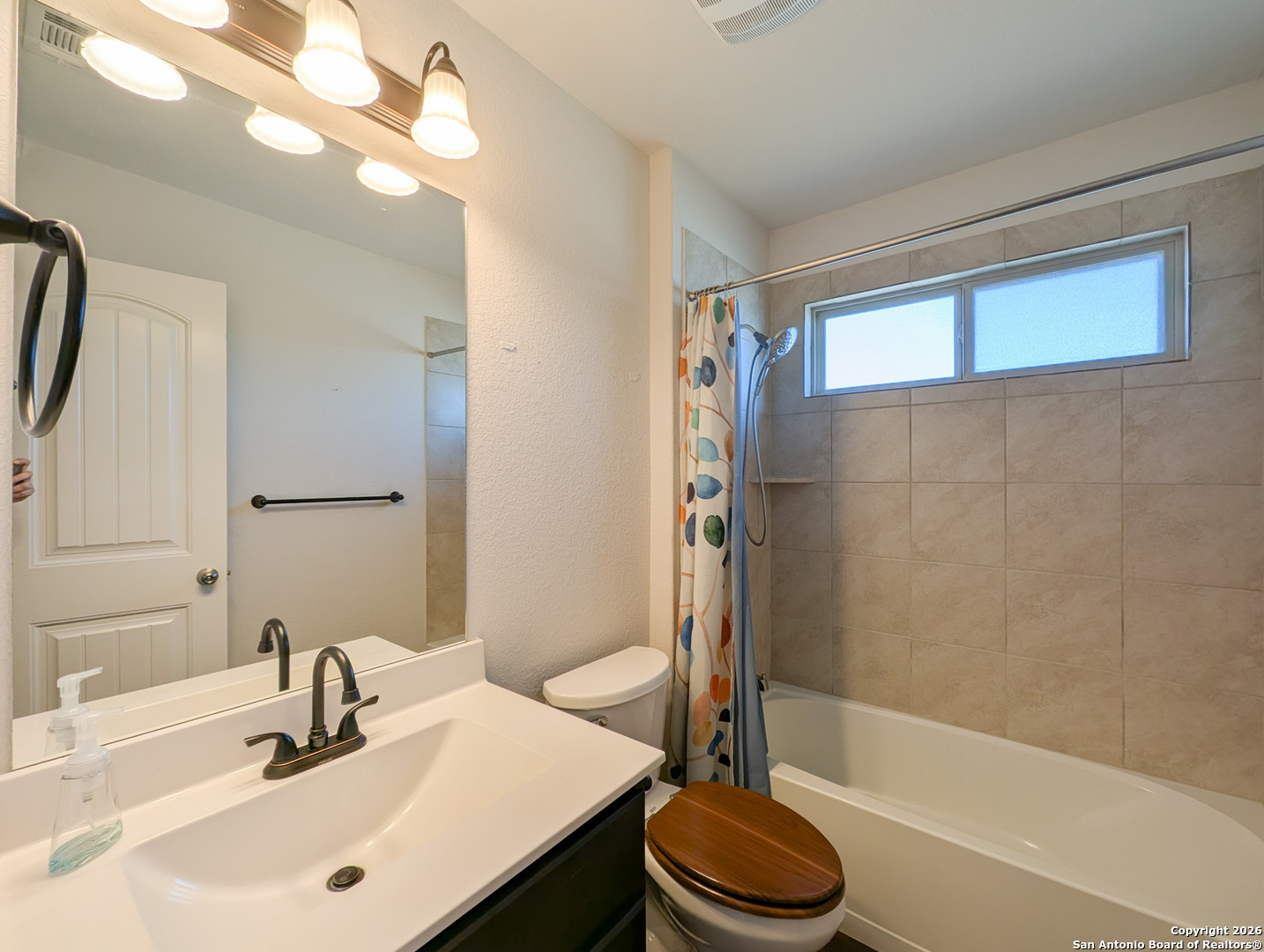2494 McCrae New Braunfels, TX 78130 - Photo 17 of 22 a bathroom with a sink a toilet and shower