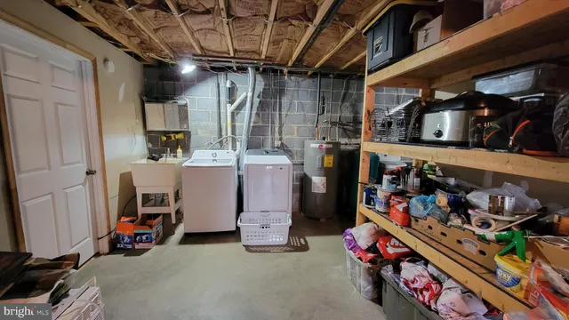 a utility room with lots of clutter and cars