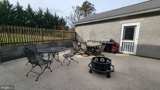 a table and chairs in the roof deck