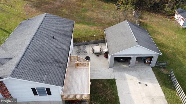 an aerial view of a house with swimming pool
