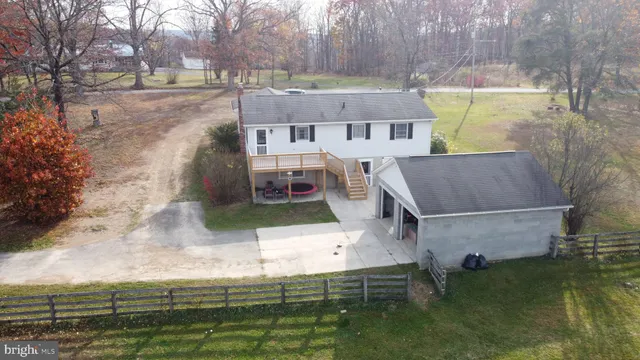 a aerial view of a house with a yard
