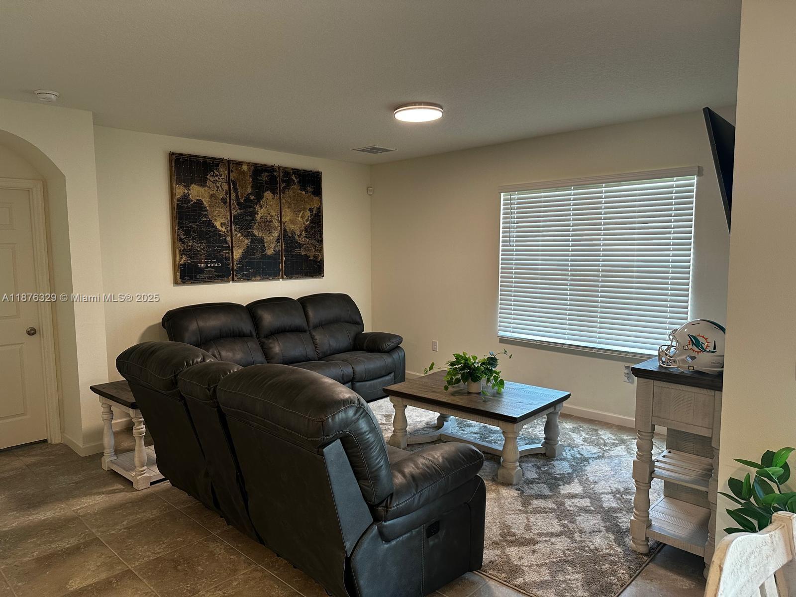 2098 Southwest Altman Avenue Port St. Lucie, FL 34953 - Photo 13 of 27 a living room with furniture and window