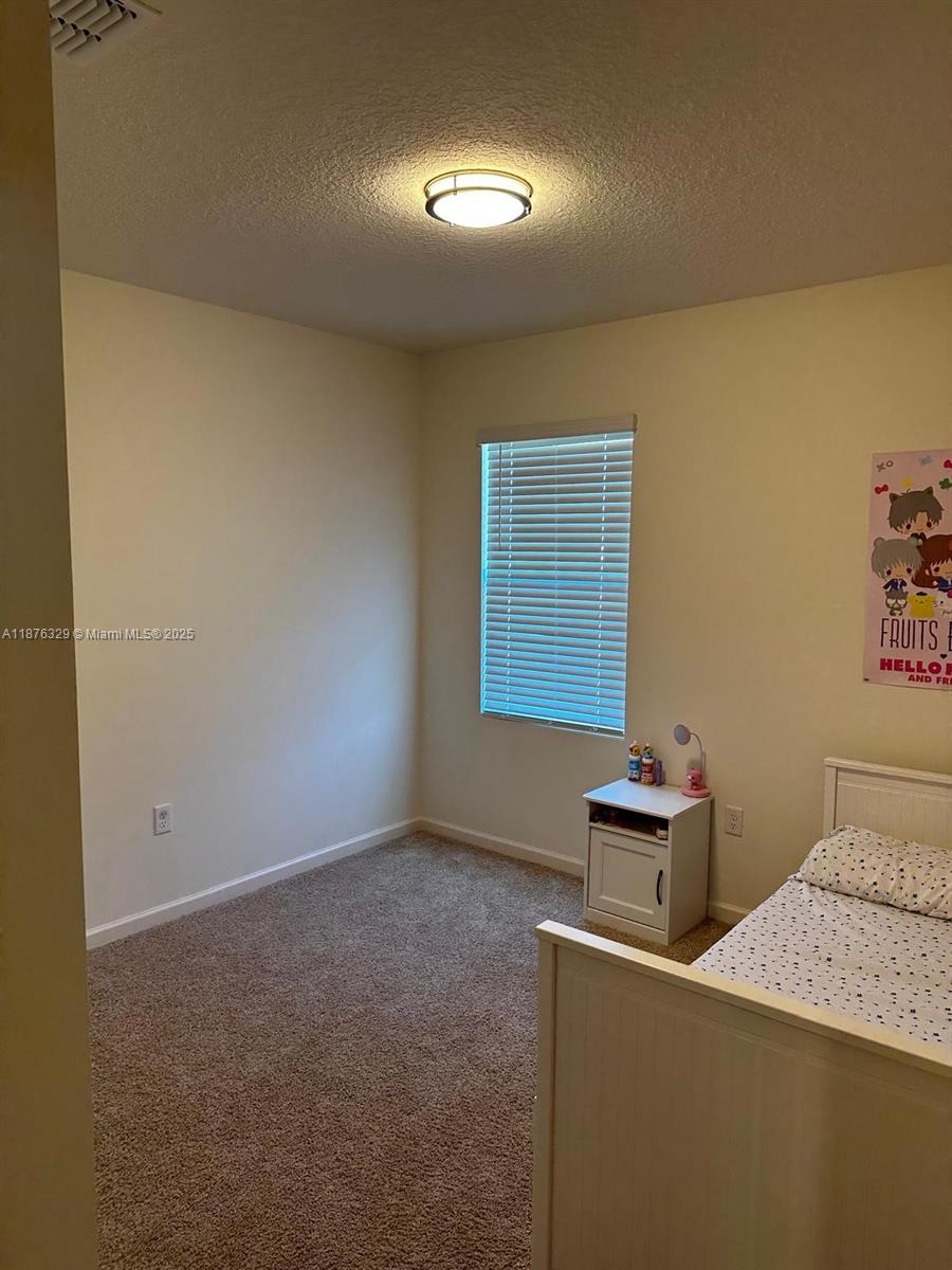 2098 Southwest Altman Avenue Port St. Lucie, FL 34953 - Photo 20 of 27 a room with a desk and chair