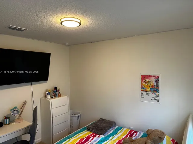 a room with furniture and a flat screen tv