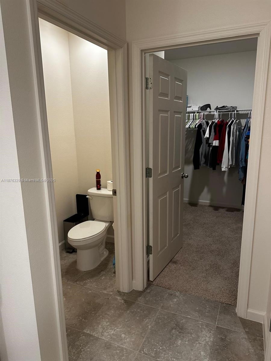 2098 Southwest Altman Avenue Port St. Lucie, FL 34953 - Photo 24 of 27 a view of a closet and storage