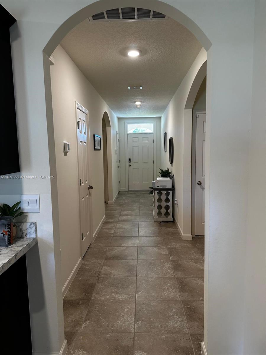 2098 Southwest Altman Avenue Port St. Lucie, FL 34953 - Photo 6 of 27 a view of a hallway